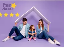 A caucasian couple holds two white boards that unite to create a roof over their daughters head as they smile