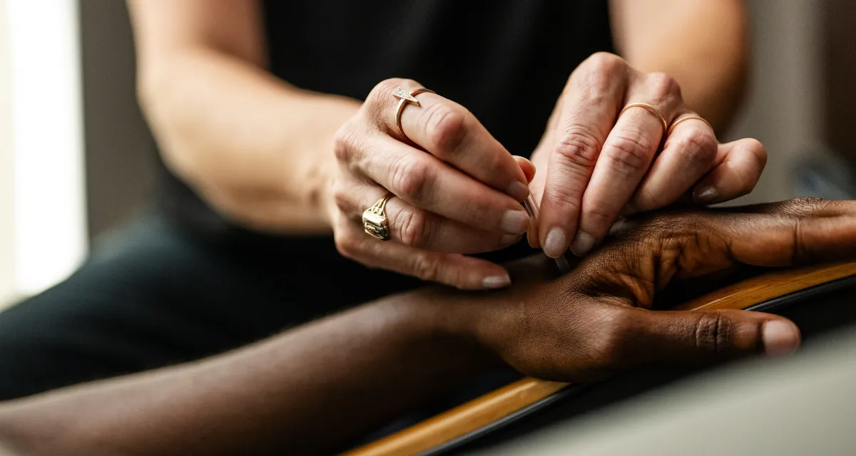 An image of a woman receiving acupuncture at the YMCA
