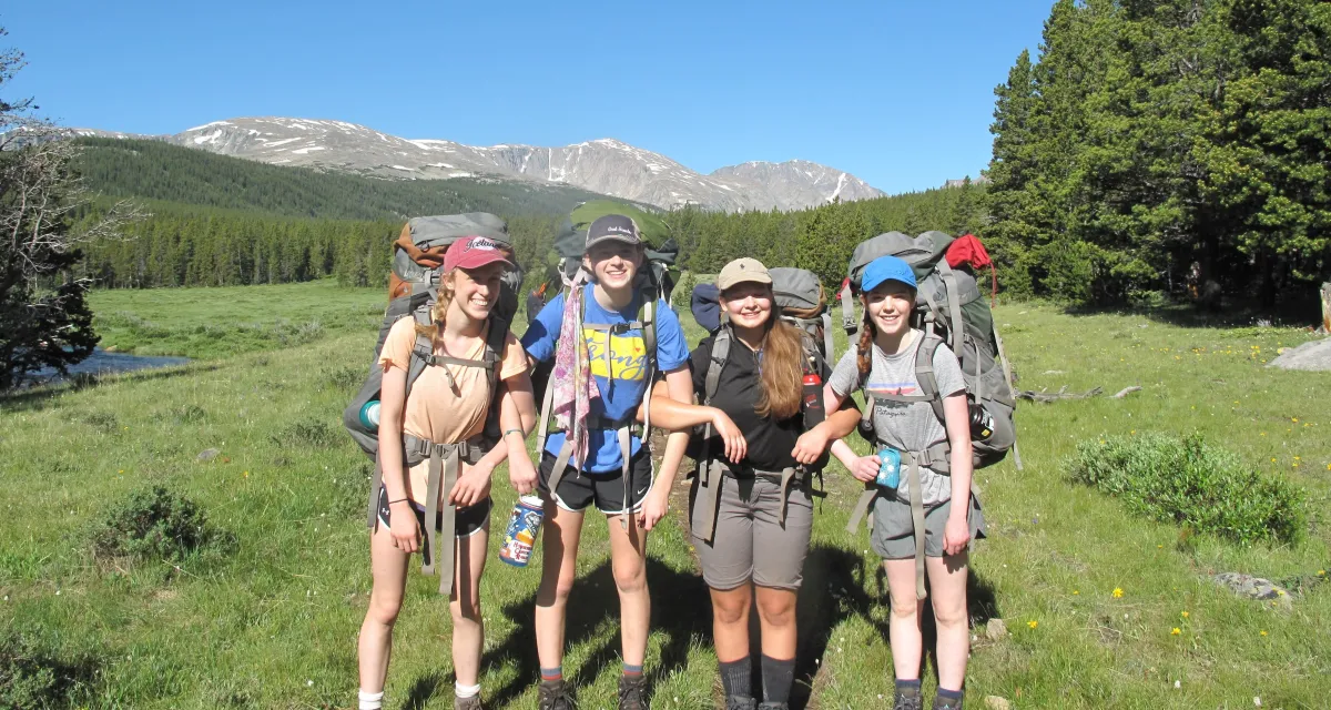 Kids backpacking in the mountains