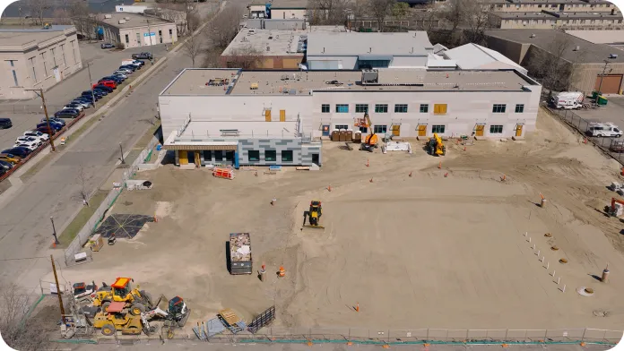 An aerial view of the Peter J. King Center building construction site with machinery.