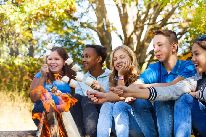 Teens roasting marshmallows