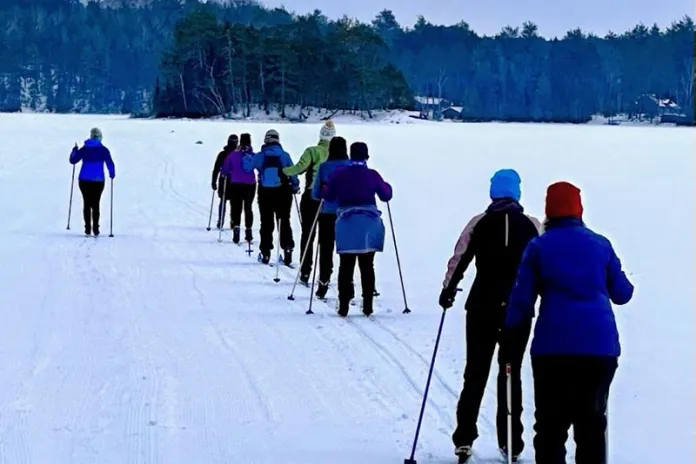 Y She Skis participants cross country skiing at Camp du Nord