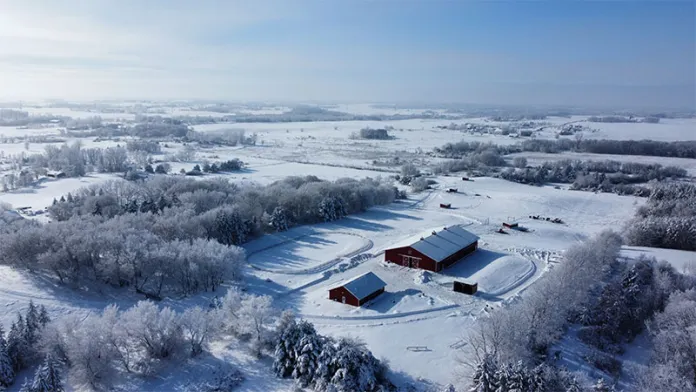 Aerial shot of Gathering Pines covered in snow.