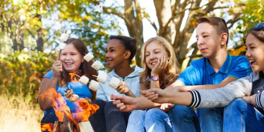 Teens roasting marshmallows